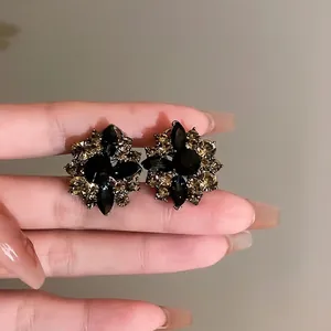 Vintage flower stud earrings with black and champagne rhinestones for women
