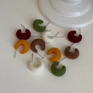 Group of colorful flocked C-shaped stud earrings with silver needles in a minimalist style