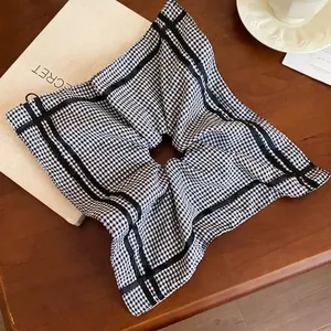 Chic black and white gingham square scrunchie for stylish ponytail styling