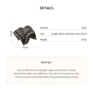 Detail view showing black and white checkered fabric scarf hair tie with product dimensions