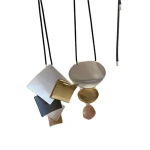 Minimalist geometric metal pendant necklace with matte silver and gold finish design