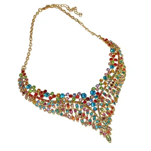 Vintage palace style necklace with colorful rhinestones and leaf fringe details in gold