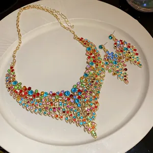 Detailed view of a colorful crystal leaf necklace and matching earrings set.