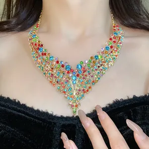 Detailed shot of a colorful leaf-shaped zircon fringe necklace in retro palace style.