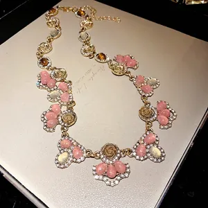 French vintage floral necklace with pink cat's eye stones and crystal teardrop pendants.