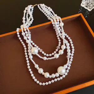 Vintage multi-layer faux pearl necklace with irregular oversized beads on a tray