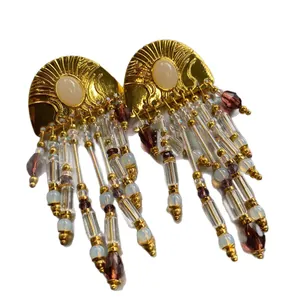 Vintage ethnic style beaded tassel earrings with gold-tone finish and silver needles