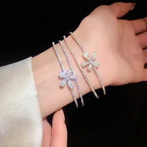 Elegant double-layered open bracelet featuring zircon pavé flower charm for women.