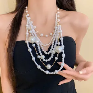 Detailed close-up of a multi-layered irregular pearl statement necklace for women