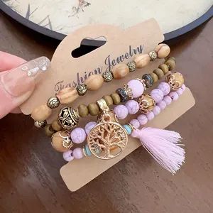 Detailed view of Bohemian beaded bracelet set with Tree of Life charm and pink tassel