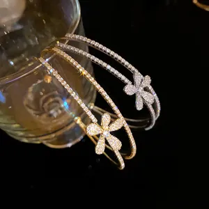 Macro detail of double-layer zircon flower bangle showing intricate stone setting