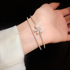 Detailed close-up of double-layer zircon flower open bracelet with sparkling stones.