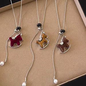 Flocked rocking horse necklace with pearl accents in red, tan and brown color variants