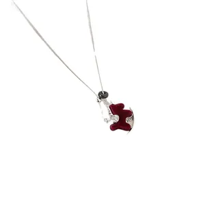 Elegant burgundy flocked horse pendant necklace on a delicate silver-tone snake chain.