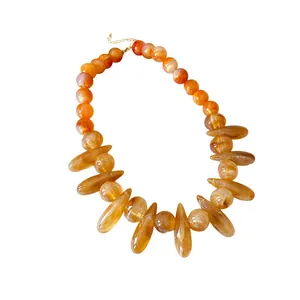 Bold acrylic marbled statement necklace with irregular amber oval and round beads