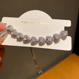 Elegant silver-toned heart-shaped zirconia bracelet with adjustable chain for women