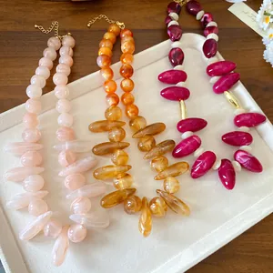 Macro detail showing marbled textures of acrylic chunky necklaces in three colors