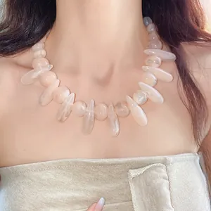 Detail view of acrylic marbled irregular necklace on model