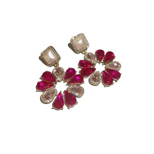 Elegant pink zircon flower stud earrings with silver needles on a white background