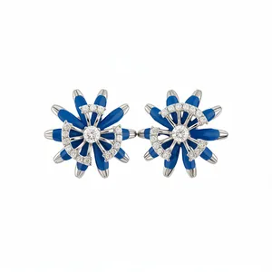 Elegant blue enamel flower stud earrings with shimmering stones in a vintage style.
