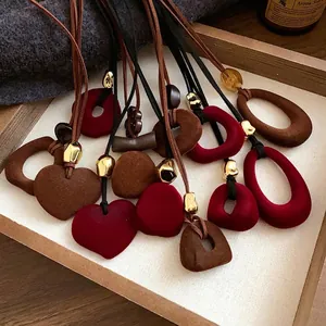 Retro velvet necklace collection with heart and oval pendants in red and brown