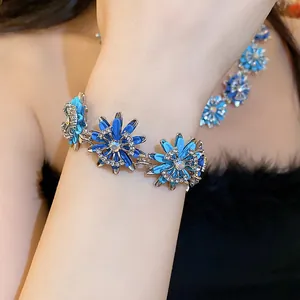 Elegant blue floral vintage jewelry set with crystal-encrusted bracelet and matching necklace