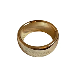 Minimalist polished gold twisted open bangle bracelet with a high gloss luxury finish