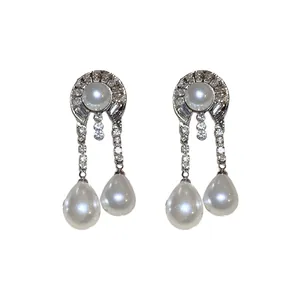 Eleganti orecchini vintage in argento con perle bianche e accenti di diamanti