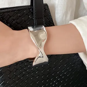 Detailed view of the polished twisted silver open cuff bracelet for stylish women