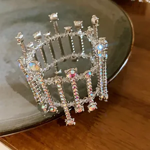 Close-up of elegant crystal geometric bracelet with rainbow rhinestones on a plate
