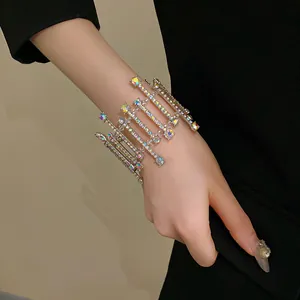 Close-up of geometric crystal encrusted bracelet with iridescent stones on a model wrist