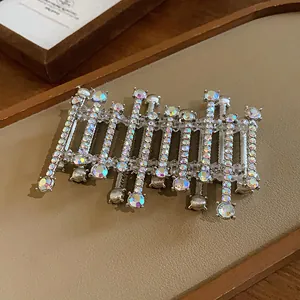 Detailed close-up of a geometric cuff bracelet adorned with shimmering iridescent crystals