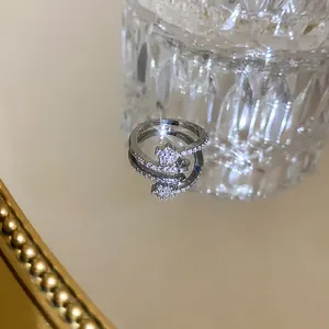 Macro view of a silver-toned open ring featuring a sparkling star-shaped zircon centerpiece