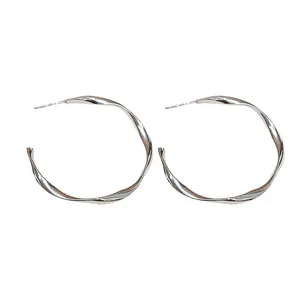 Elegant twisted silver hoop earrings with minimalist design for women's fashion jewelry