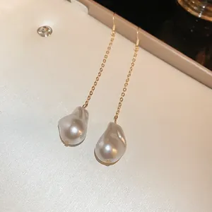 Elegant gold chain dangle earrings with irregular baroque pearls in white