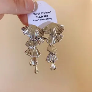 Elegant silver-tone multi-layered fan-shaped dangle earrings with a minimalist design.