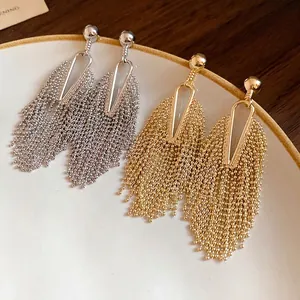 Elegant irregular metal tassel drop earrings in polished gold and silver finishes