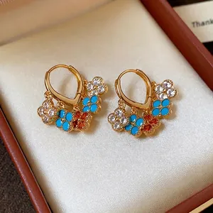 Elegant gold-plated hoop earrings with multi-colored zircon flower charms