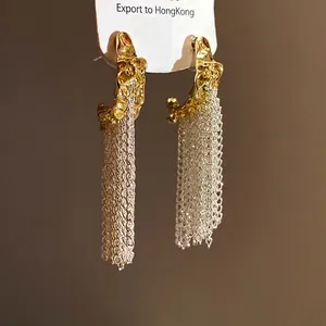 Elegant gold wrinkled C-shaped earrings featuring long silver mesh tassels, S925 needle