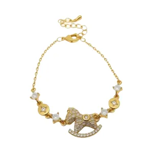 Exquisite 14k gold plated rocking horse charm bracelet featuring sparkling cubic zircons