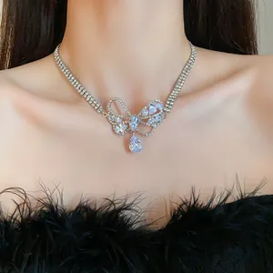 Detailed shot of an elegant silver-toned butterfly necklace with sparkling zircon drop.
