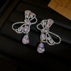 Detailed close-up of elegant butterfly bow earrings with sparkling zirconia waterdrop drops