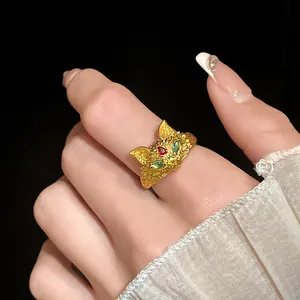 Detailed close-up view of a 24K gold-plated fox ring featuring zircon gemstones