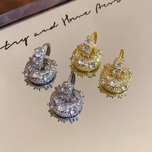 Elegant gold-plated U-shaped bag-style earrings with sparkling cubic zirconia accents