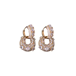 Luxurious gold plated U-shaped hoop earrings featuring shimmering pave zircon stones