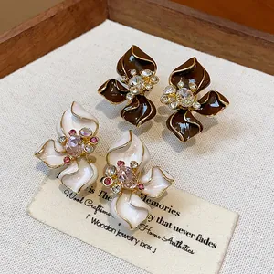 Retro flower stud earrings with rhinestones and enamel petals in warm autumn tones