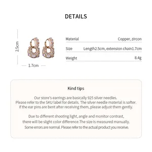 Detailed view of U-shaped bag earrings with copper zircon parameters and tips