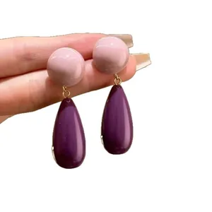 Vintage mauve and deep purple acrylic teardrop dangle earrings featuring silver needles