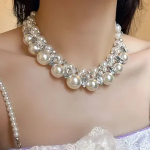 Elegant French vintage pearl and rhinestone beaded necklace shown on model neck