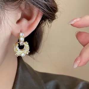 Elegant gold-plated U-shaped bag design earrings with sparkling zircon stones for women